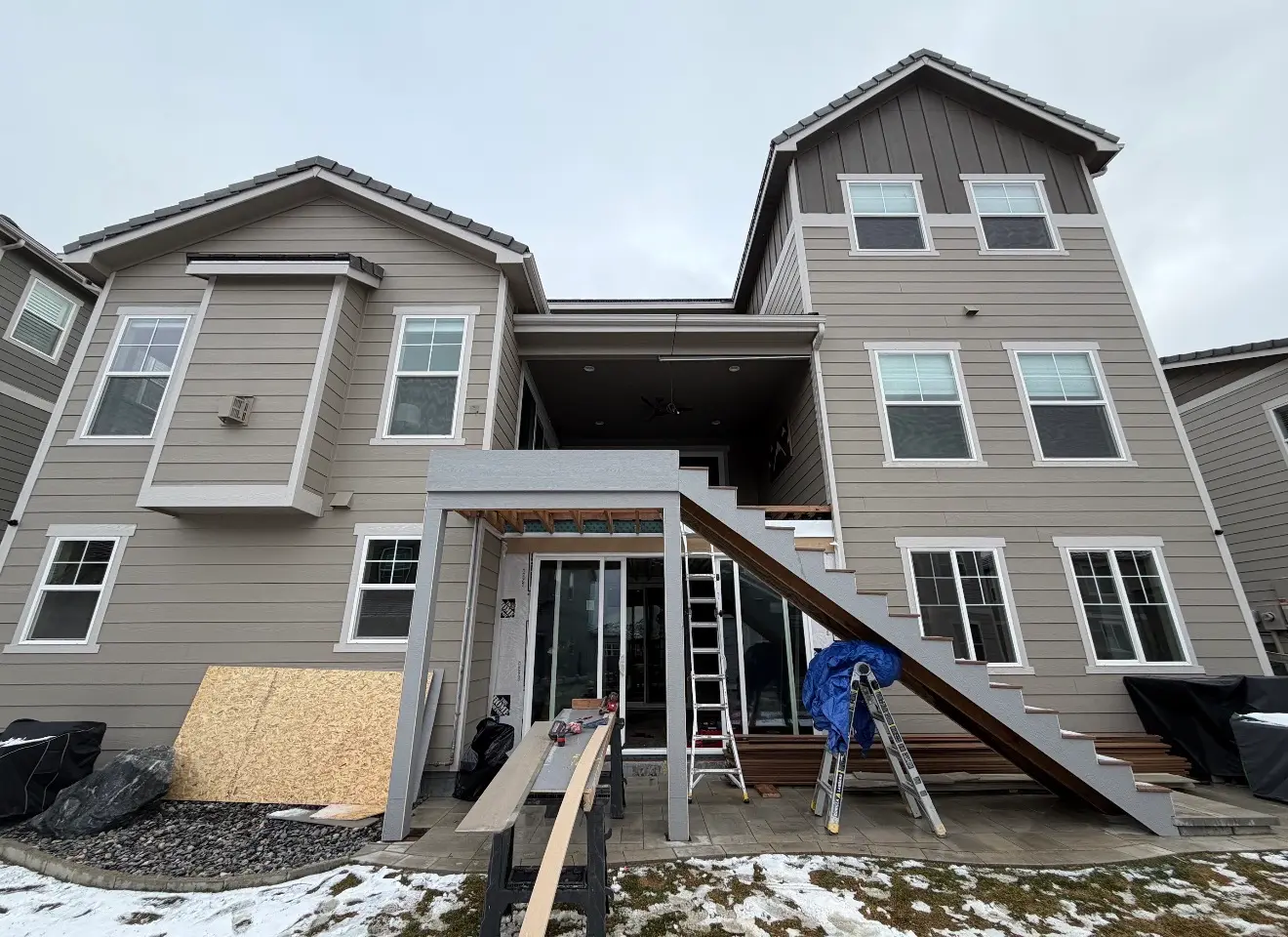 Framing and structure phase of two-story patio construction