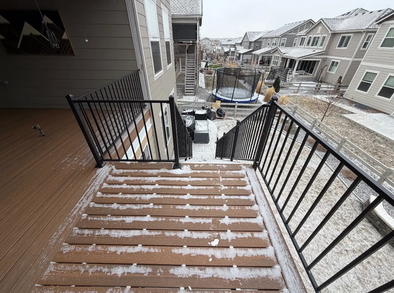 Before photo of exposed lower patio and deck in Broomfield Colorado