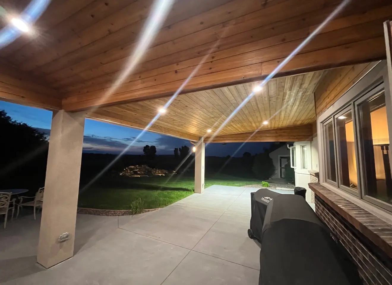 View from under the cascade patio roof looking across backyard in Boulder Colorado