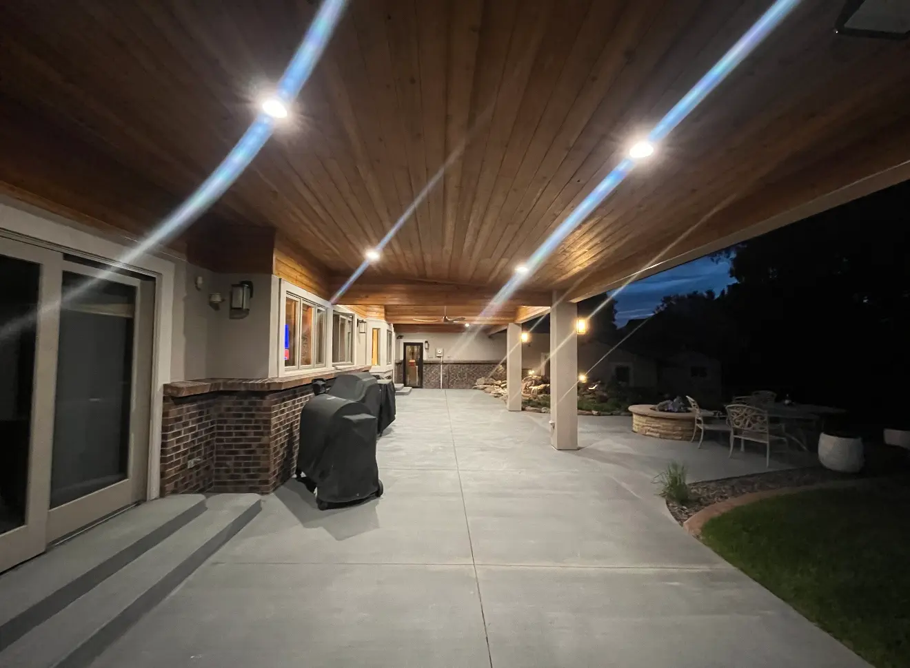 Long concrete patio under wood ceiling with lighting in Boulder Colorado
