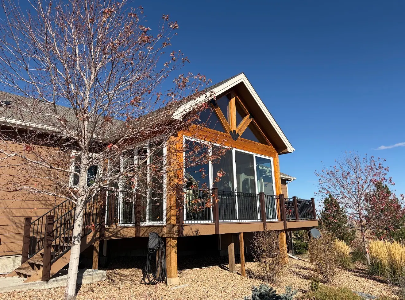 Angled exterior view of enclosed elevated sunroom in Elizabeth Colorado