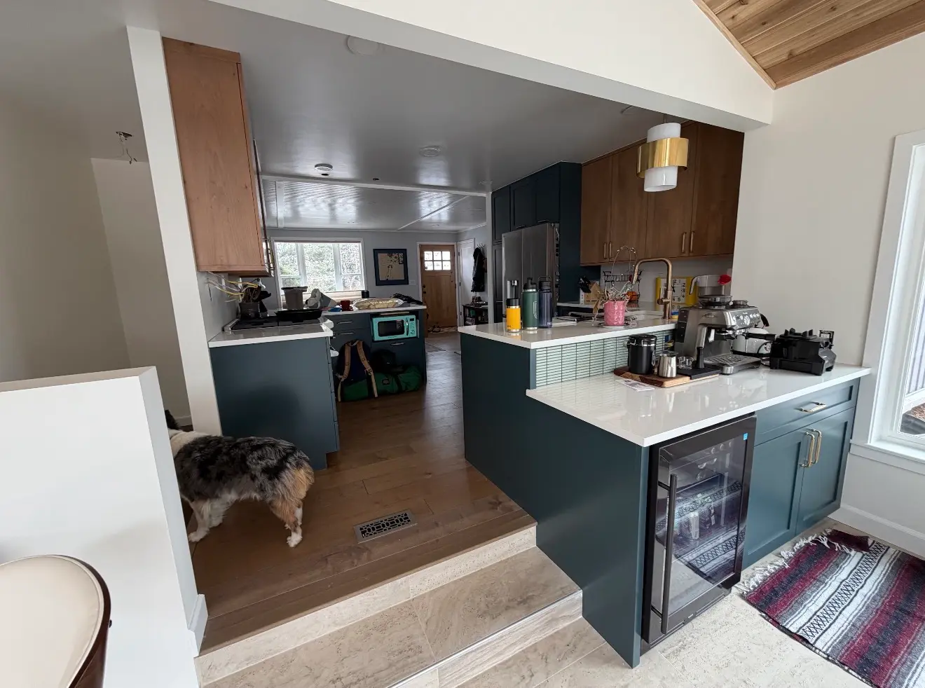 Updated kitchen with island connected to new sunroom in Boulder Colorado