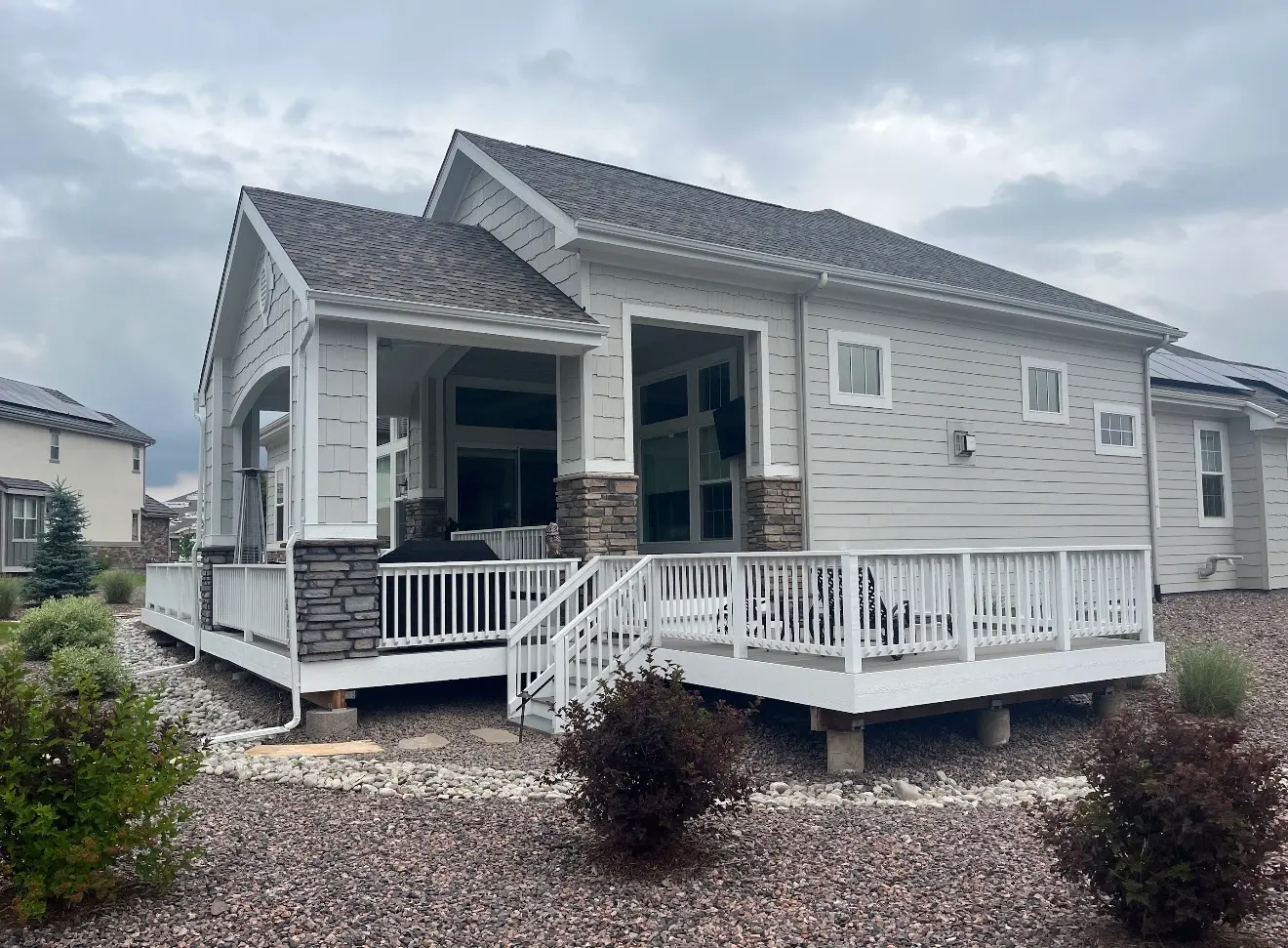 Angled exterior view of covered deck matching house architecture in Columbine Valley Colorado