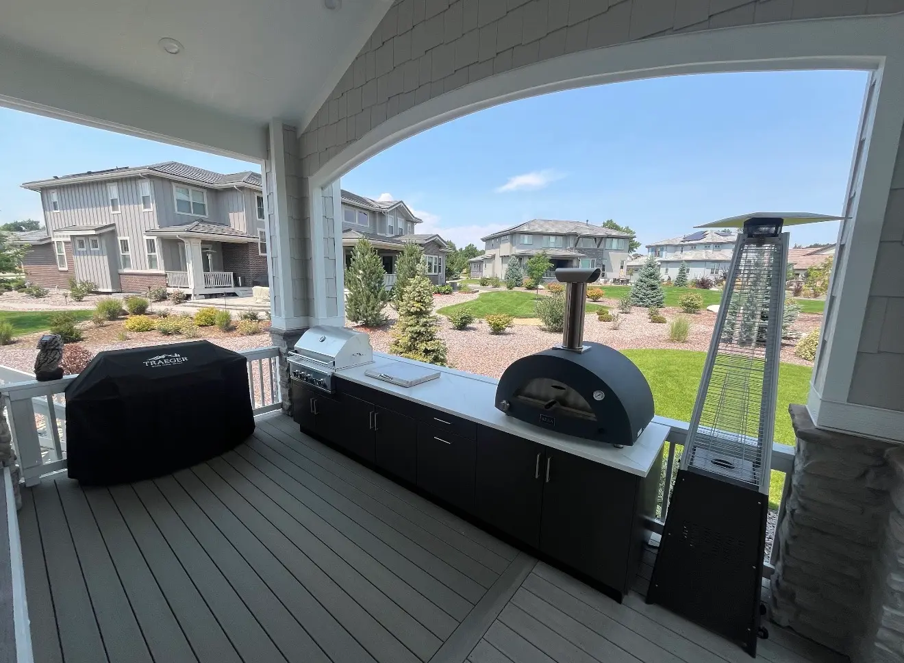 Outdoor kitchen appliances and covered deck space in Columbine Valley Colorado