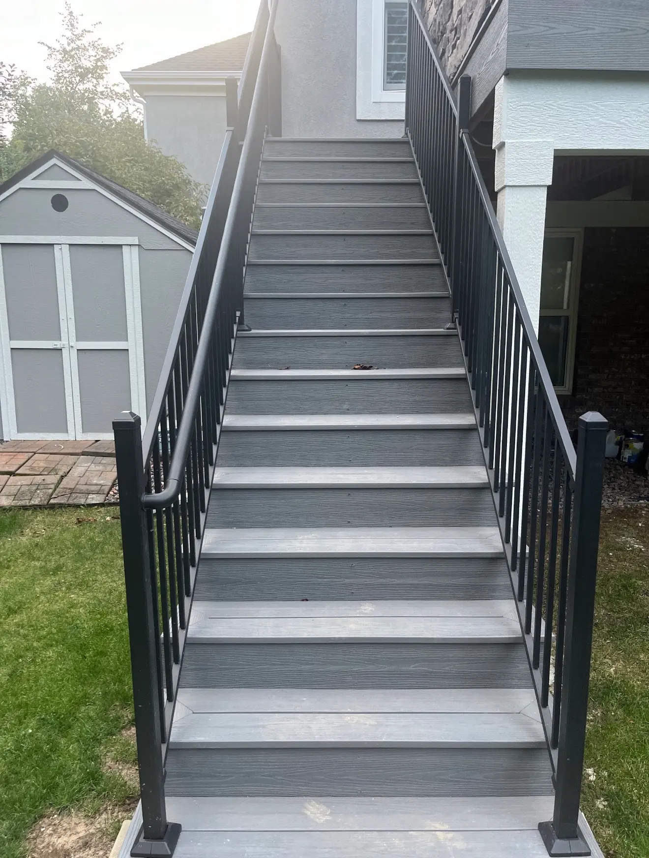 Composite staircase with steel railings for elevated deck in Aurora Colorado