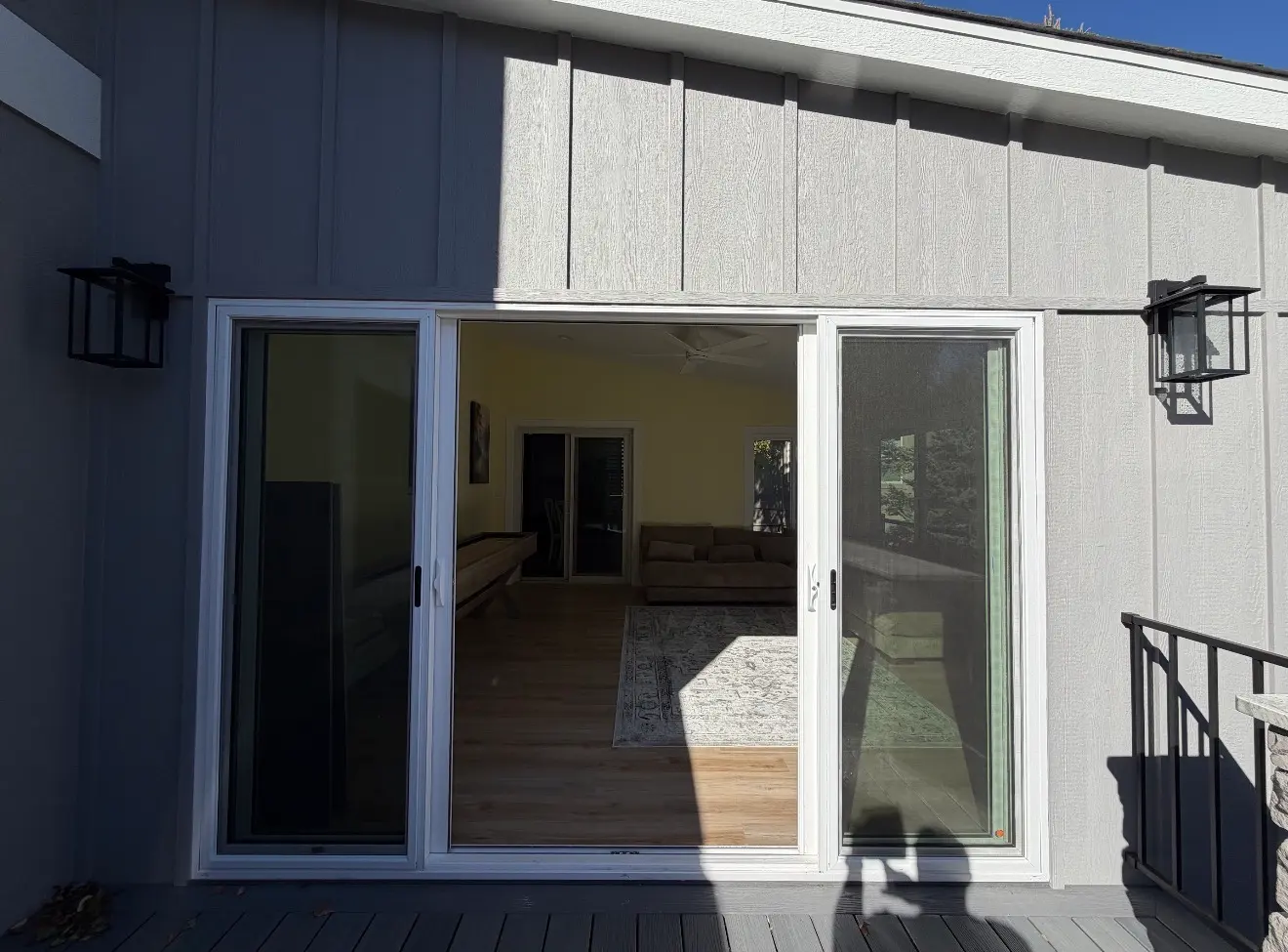Sliding door access from elevated sunroom to grilling deck in Aurora Colorado