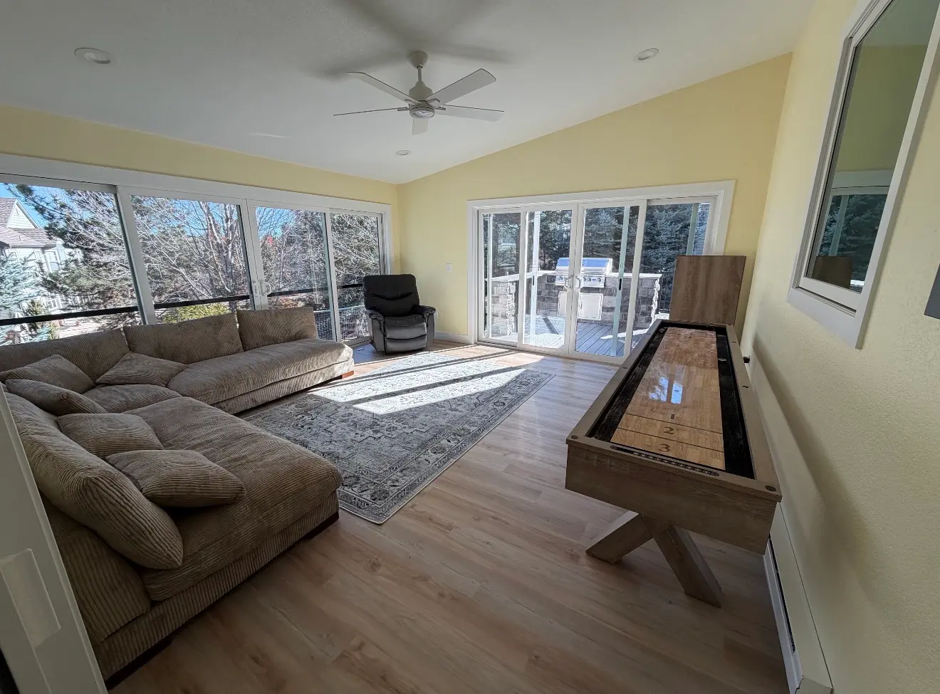 Interior view of second-story sunroom connected to deck in Aurora Colorado